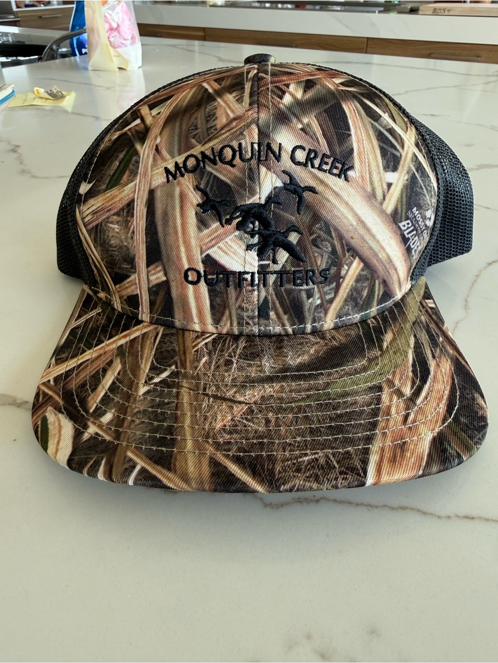 Monquin Creek Outfitters Camo Trucker Hat - Brown/Black